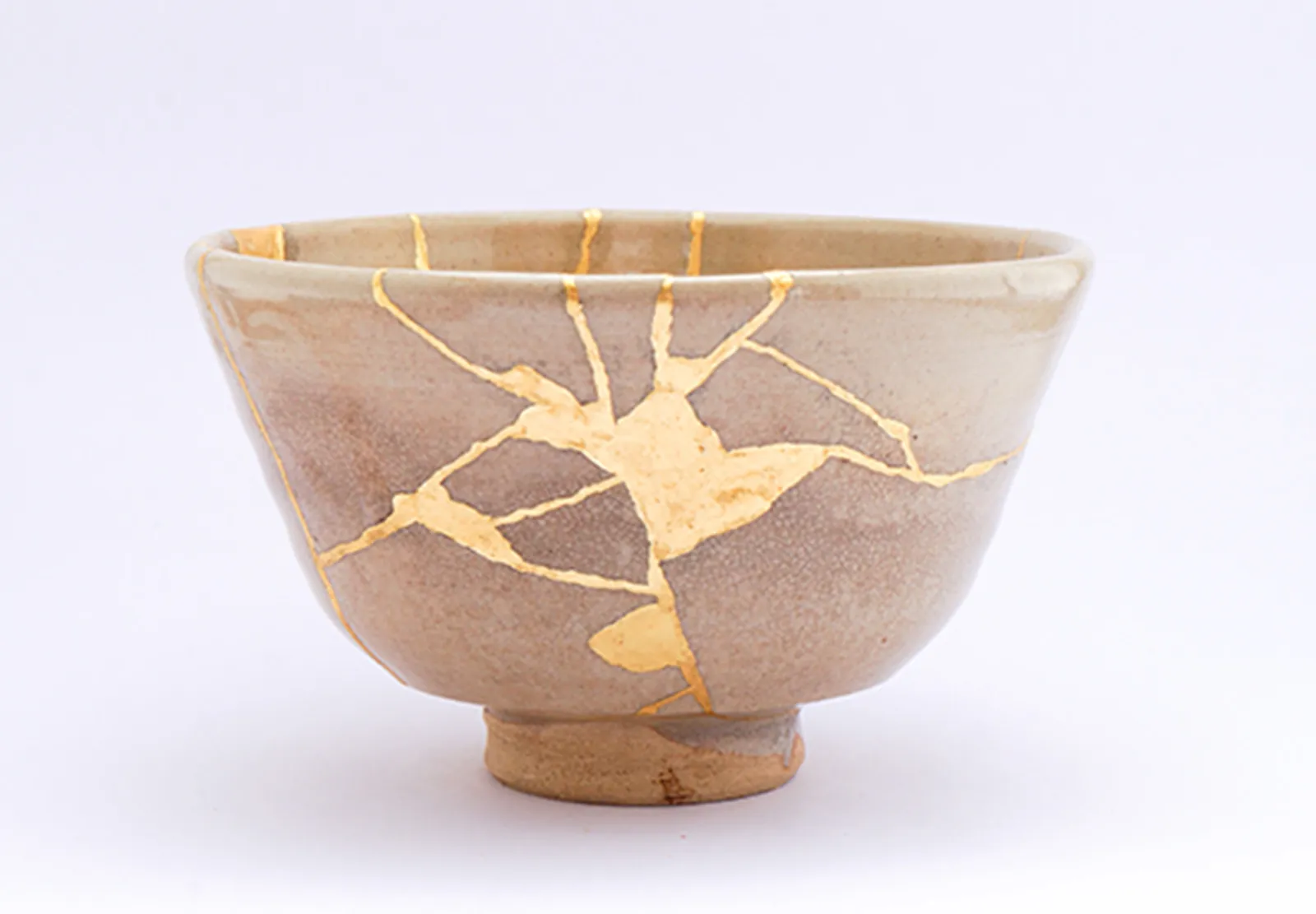 Kintsugi bowl - broken pottery repaired with gold, symbolizing beauty in brokenness